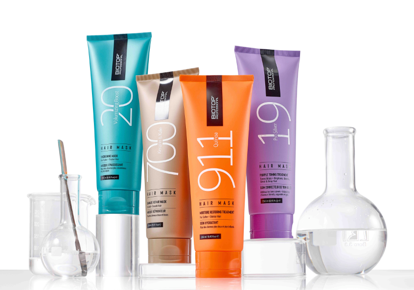 Set of BIotop Professional hair mask bottles with different colors on a white scientific background